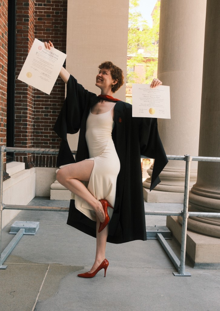 Katya celebrating Harvard graduation with diplomas